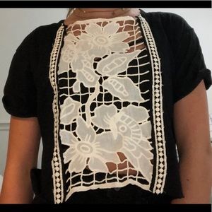 A black tee with lace flowered design